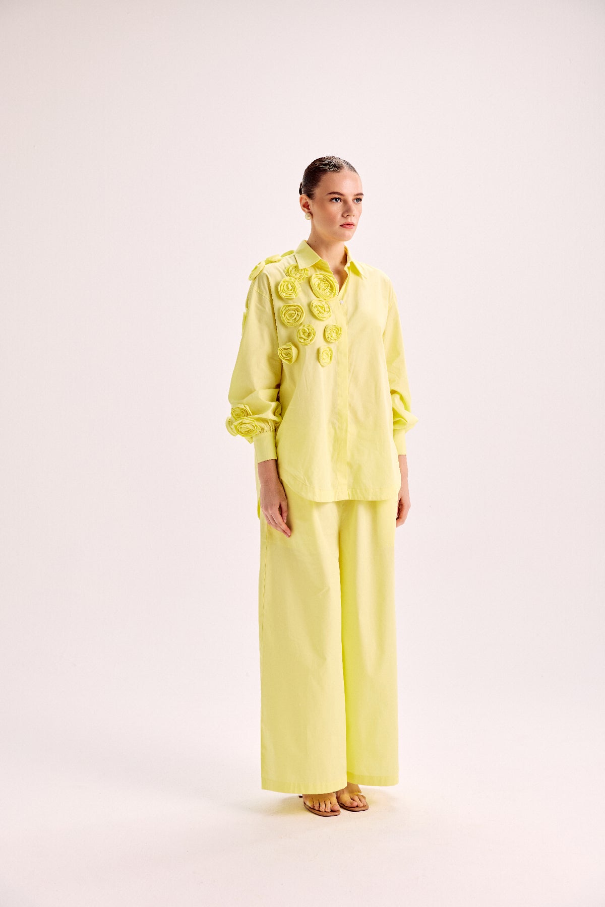 Shirt With Mounted Roses Paired With Loose Fit Pants