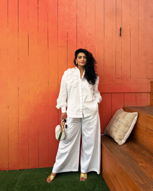 White Shirt With Multiple Roses Paired With Pants